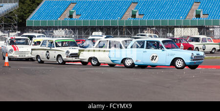 Close racing during the Warwick Banks Trophy for Under 2 litres Touring Cars, Silverstone Classic 2015. Stock Photo