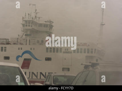 Red Funnel Isle of Wight ferry arriving at Southampton mainland port in bad weather of heavy rain, strong winds, fog and poor visibility. Stock Photo