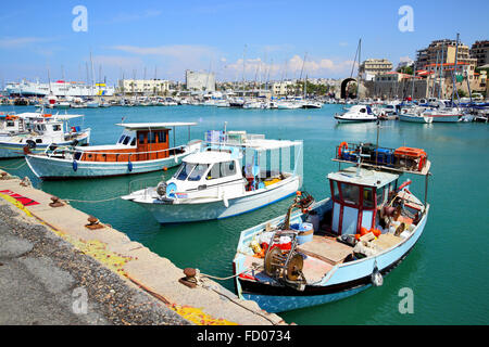 Old fishing boats and yachts in Heraklion port, Crete, Greece Stock Photo