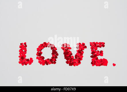 The word LOVE on a bulletin board using cut-out paper letters in the ransom  note effect typography Stock Photo - Alamy