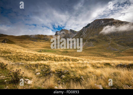 Low clouds over pastures of Piva Plateau, Durmitor mountains in Durmitor National Park, Dinaric Alps, near Zabljak, Montenegro Stock Photo