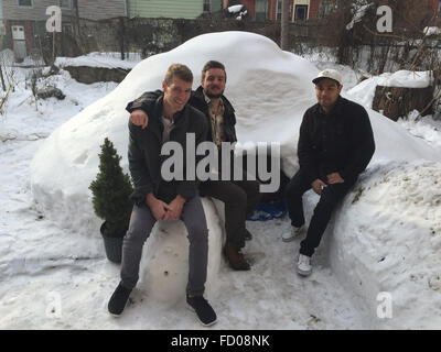 Brooklyn, New York, USA. 26th Jan, 2016. Justin Seely (l-r), Patrick Horton and Griffin Jones standing by the igloo they built in Brooklyn, New York, USA, 26 January 2016. After the severe winter storm on the east coast of the USA, the flatmates built an igloo and advertised it on onlone rental platform Airbnb for 200 dollars per night. PHOTO: JOHANNES SCHMITT-TEGGE/DPA/Alamy Live News Stock Photo