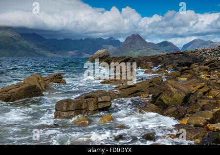 View towards the Black Cuillin mountains across Loch Scavaig from the beach at Elgol on the Isle of Skye, Scotland, UK Stock Photo