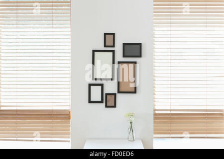 Empty frames attached on the wall Stock Photo