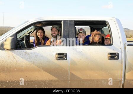 U.S. Speaker of the House Paul Ryan poses with his children Liza, Charles, and Sam in his pickup truck in Janesville, Wisconsin. Stock Photo