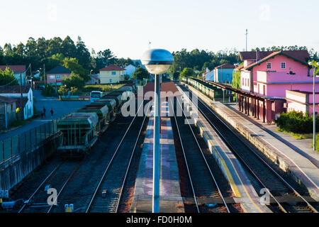 High Angle View Of Street Light Against Railroad Tracks Amidst Houses and Train Station