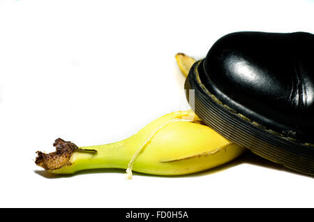 old shoe slips on a banana peel Stock Photo