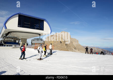 The ski slope and skiers at Passo Groste ski area, Madonna di Campiglio, italy Stock Photo
