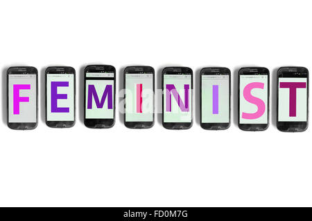 Feminist  on the screens of smartphones photographed against a white background. Stock Photo