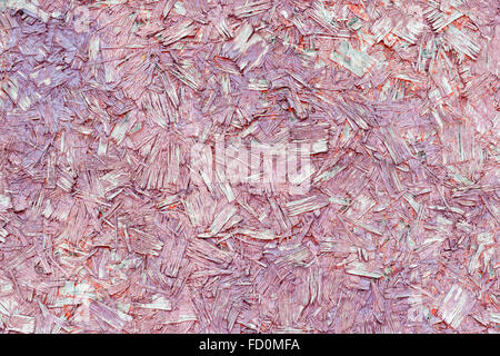 Compressed faded red chipboard (pressed wood) Stock Photo