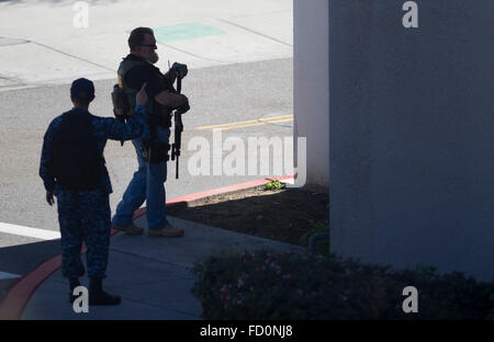 San Diego, USA. 26th Jan, 2016. Two armed policemen stand guard outside the Naval Medical Center in San Diego, California, the United States, Jan. 26, 2016. No evidence or signs of casualties were found after sweeps of a building at the Naval Medical Center in San Diego where an active gunshot was reported Tuesday morning, said a Navy commanding officer. © Yang Lei/Xinhua/Alamy Live News Stock Photo