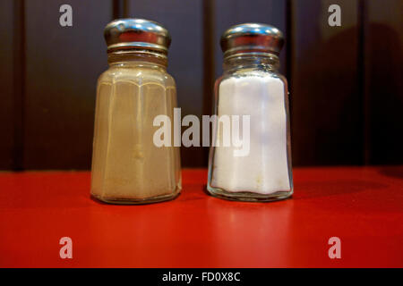 Salt and Pepper Shakers on a restaurant table Stock Photo