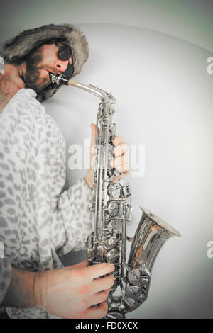 Bearded hipster plays jazz saxophone in leopard print bathrobe taken with fisheye lens Stock Photo