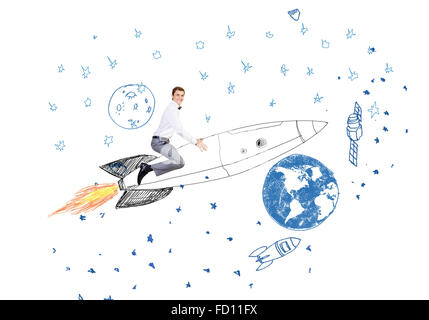 Young businessman flying in sky on drawn rocket Stock Photo