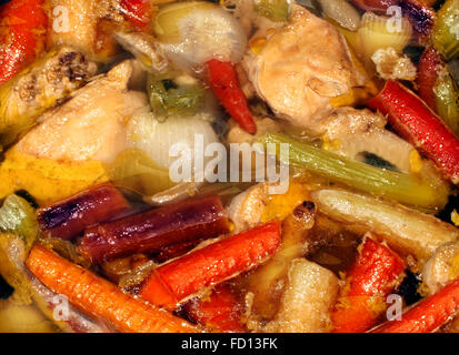 Rustic soup and healthy eating real food background made from scratch as a slow cooking hearty stew made of fresh chicken and market garden whole natural vegetables. Stock Photo