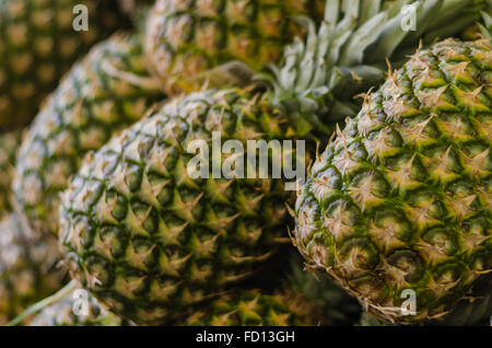 Pineapples for sale at market Stock Photo