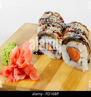 Maki Sushi with Salmon on a wooden tray. Selective focus Stock Photo