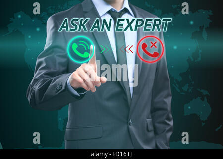 Businessman pressing button on touch screen interface and select Ask an expert. Business concept. telephone call Stock Photo