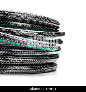Rolled garden hose isolated on white Stock Photo