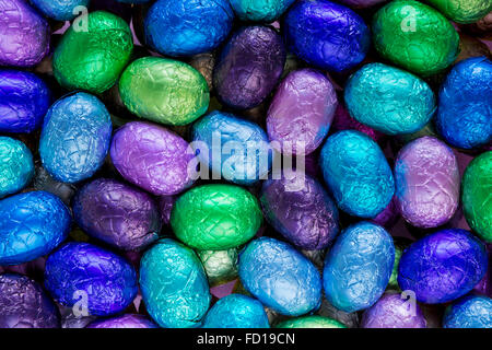 Assortment of blue, green and purple chocolate Easter eggs. Stock Photo