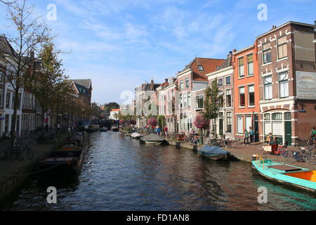 Boats moored along Oude Rijn canal  in the historical centre of Leiden, The Netherlands Stock Photo
