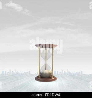 Conceptual image with huge sandglass. Time concept Stock Photo