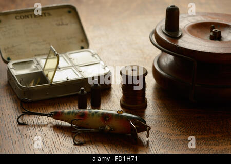 A fishing tackle box, complete with lures and fishing gear on a wooden  background on top. A set of fishing lures for spinning fishing Stock Photo  - Alamy