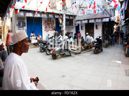Stone Town, Zanzibar, Tanzania - January 1, 2016: People going about their daily business in Stone Town market, on the island of Stock Photo