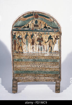 Egyptian Art. Painted wooden stele. The deceased before Osiris, Isis and Anubis. From Thebes. New Kingdom of Egypt (1550 BC-1977 BC). Egyptian Museum of Turin. Italy. Stock Photo