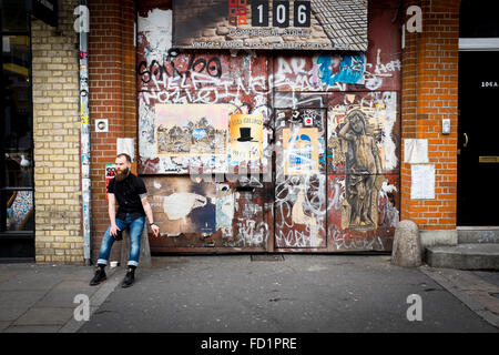 A young male with a long beard smoking, London, UK Stock Photo