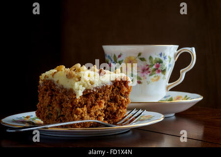 Tea and carrot cake on china crockery Stock Photo