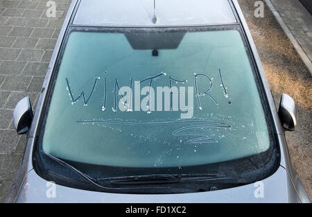 The word winter written on a frozen car windscreen Stock Photo