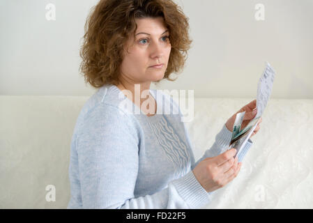 adult woman with receipts and Russian money Stock Photo