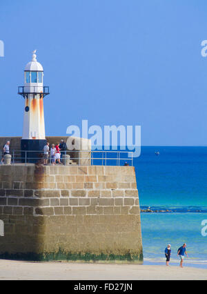 Lighthouse on Smeaton's Pier, Harbour Beach, St Ives Town, Cornwall, England, UK in Summer Stock Photo