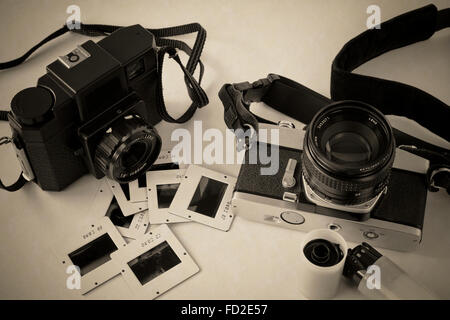 Two old cameras, slide and film Stock Photo