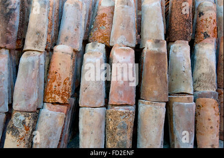 stack of colored rooftiles at a junkyard Stock Photo
