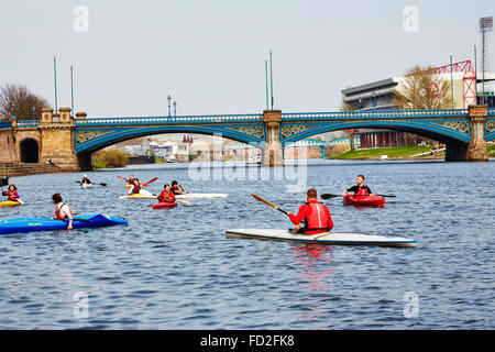 People kayaking on the River Trent near Trent Bridge, Nottingham, England, UK. Stock Photo