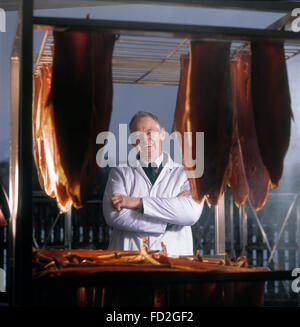 Marilyn Rattray and salmon smoking expert Jack Wilkinson with some of the smokes of Alaskan and Scottish Salmon at the Spey Valley Smoke House Scotland Stock Photo