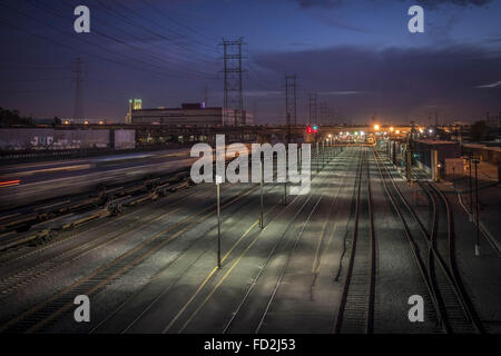 Los Angeles, California, USA. 16th Dec, 2013. An Amtrak train rolls through between a maintenance yard and the LA River, from 7th Street, north of the Santa Monica freeway. © Fred Hoerr/ZUMA Wire/Alamy Live News Stock Photo