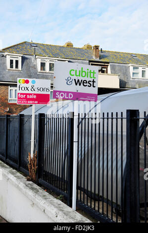 Former council flats estate for sale in Brighton with Estate Agent boards Stock Photo