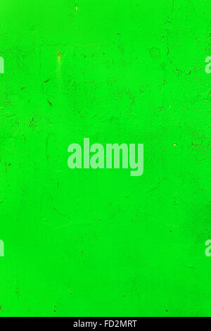 Bright background old damaged wall with cracks, scratches, painted with green paint. Textured background for your concept or pro Stock Photo