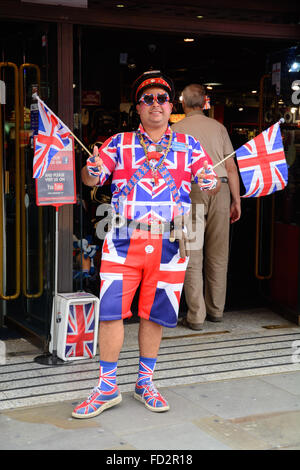 Man in union jack souvenir clothing outside the Cool Britannia store on Piccadilly Circus in London, Great Britain Stock Photo