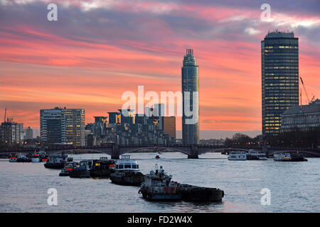 River Thames & sunset dusk sky beyond Vauxhall Bridge from Westminster St George Wharf skyscraper & Millbank office tower London skyline England UK Stock Photo