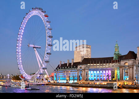 London Eye and the old "County Hall" building with Shell building beyond England UK Stock Photo