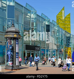 Summer shoppers in Croydon town centre pedestrianised shopping street with large Next retail business shop store building in South London England UK Stock Photo