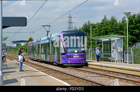 Passenger waiting at Croydon public transport tramlink station with tram to Elmers End arriving at Waddon Marsh platform stop South London England UK Stock Photo