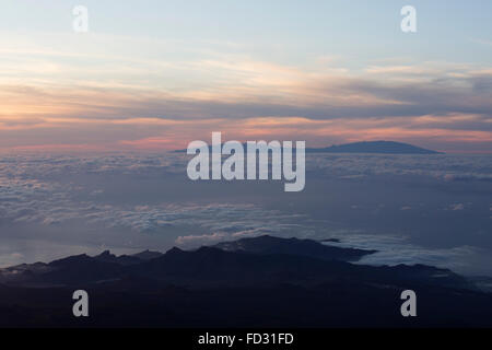 The island of La Gomera in the Canary Islands. Clouds hang over the Atlantic Ocean, seen from Mount Teide in Tenerife. Stock Photo