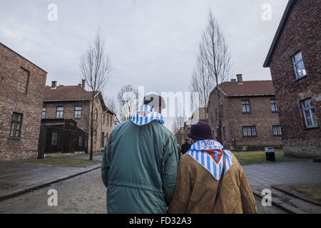 Oswiecim, Malopolska, Poland. 27th Jan, 2016. Two former prisoners take a walk in the stretts of the Auschwitz concentration camp, during the celebrations of the 71st anniversary of the liberation of Auschwitz in Oswiecim village, Poland. In their scarfs, the prisoner number when they were prisoners in the camp. © Celestino Arce/ZUMA Wire/Alamy Live News Stock Photo