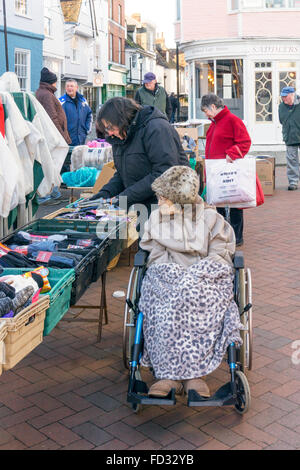 A 95 year old lady shopping on Faversham market with her carer or assistant.  MODEL RELEASED. Stock Photo