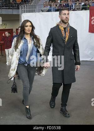 Sergio Ramos and his wife Pilar Rubio watch the Party ACB Basketball League game between Real Madrid and Barcelona at the Barclaycard Center  Featuring: Sergio Ramos, Pilar Rubio Where: Madrid, Spain When: 27 Dec 2015 Stock Photo